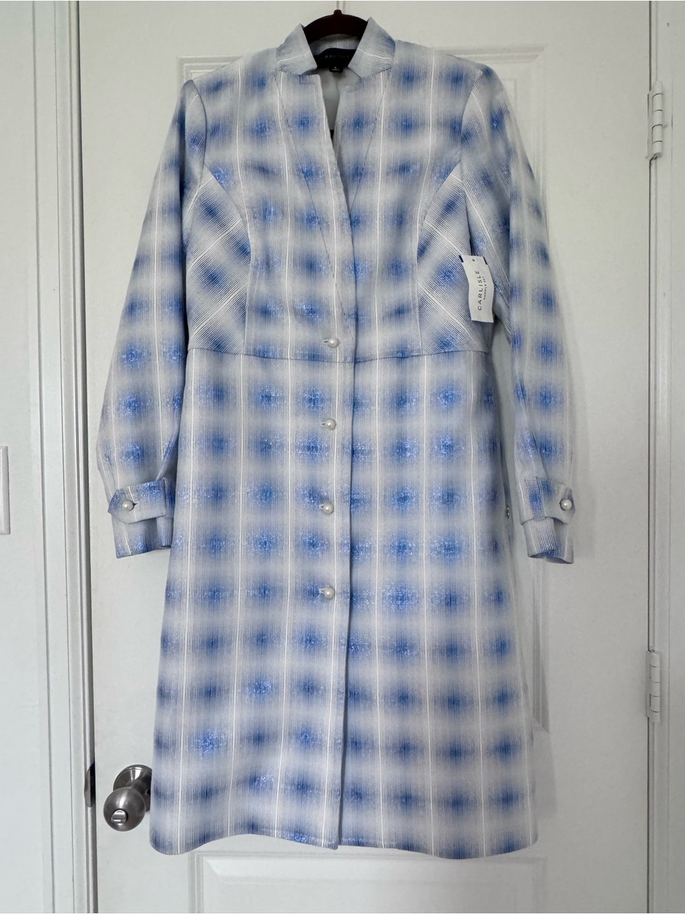 Brand new blue and white trench coat with pearl buttons. New with tags
